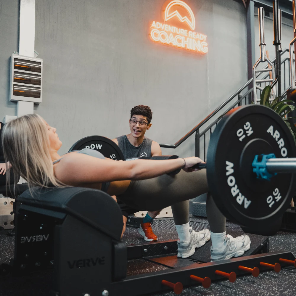 ARC gym female client being coached